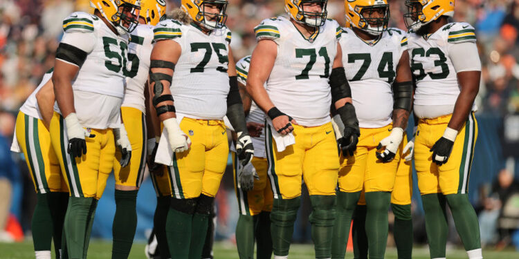 CHICAGO, ILLINOIS - NOVEMBER 17: Zach Tom #50, Sean Rhyan #75, Josh Myers #71, Elgton Jenkins #74 and Rasheed Walker #63 of the Green Bay Packers look on against the Chicago Bears at Soldier Field on November 17, 2024 in Chicago, Illinois. (Photo by Michael Reaves/Getty Images)