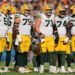 CHICAGO, ILLINOIS - NOVEMBER 17: Zach Tom #50, Sean Rhyan #75, Josh Myers #71, Elgton Jenkins #74 and Rasheed Walker #63 of the Green Bay Packers look on against the Chicago Bears at Soldier Field on November 17, 2024 in Chicago, Illinois. (Photo by Michael Reaves/Getty Images)