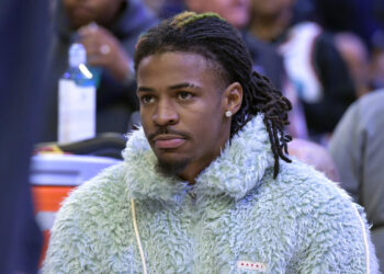 Memphis Grizzlies guard Ja Morant looks on from the bench in the first half of an NBA basketball game against the Washington Wizards Friday, Nov. 8, 2024, in Memphis, Tenn. (AP Photo/Brandon Dill)