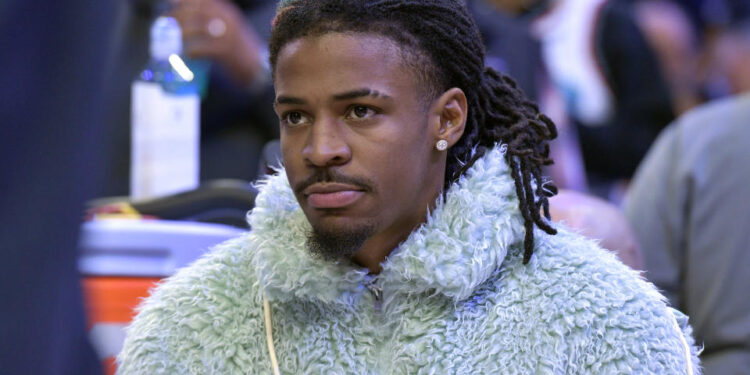 Memphis Grizzlies guard Ja Morant looks on from the bench in the first half of an NBA basketball game against the Washington Wizards Friday, Nov. 8, 2024, in Memphis, Tenn. (AP Photo/Brandon Dill)