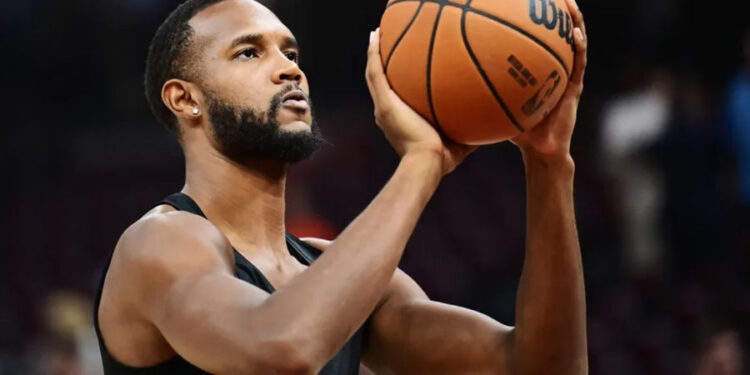 Oct 30, 2024; Cleveland, Ohio, USA; Cleveland Cavaliers forward Evan Mobley (4) warms up before the game between the Cavaliers and the Los Angeles Lakers at Rocket Mortgage FieldHouse. Mandatory Credit: Ken Blaze-Imagn Images