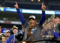 Oct 30, 2024; New York, New York, USA; Los Angeles Dodgers manager Dave Roberts (30) celebrates after winning the 2024 MLB World Series against the New York Yankees at Yankee Stadium. Mandatory Credit: Vincent Carchietta-Imagn Images