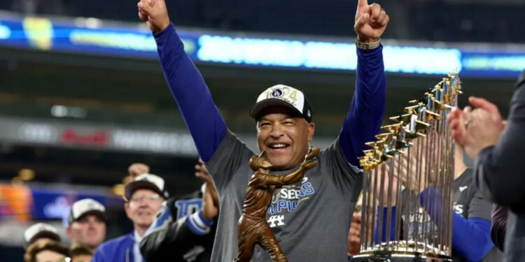 Oct 30, 2024; New York, New York, USA; Los Angeles Dodgers manager Dave Roberts (30) celebrates after winning the 2024 MLB World Series against the New York Yankees at Yankee Stadium. Mandatory Credit: Vincent Carchietta-Imagn Images