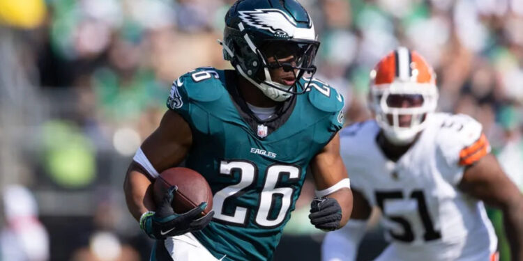 Oct 13, 2024; Philadelphia, Pennsylvania, USA; Philadelphia Eagles running back Saquon Barkley (26) runs with the ball against the Cleveland Browns during the first quarter at Lincoln Financial Field. Mandatory Credit: Bill Streicher-Imagn Images