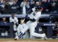 Oct 29, 2024; New York, New York, USA; New York Yankees outfielder Juan Soto (22) doubles during the eighth inning against the Los Angeles Dodgers in game four of the 2024 MLB World Series at Yankee Stadium. Mandatory Credit: Brad Penner-Imagn Images