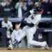 Oct 29, 2024; New York, New York, USA; New York Yankees outfielder Juan Soto (22) doubles during the eighth inning against the Los Angeles Dodgers in game four of the 2024 MLB World Series at Yankee Stadium. Mandatory Credit: Brad Penner-Imagn Images