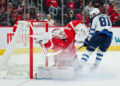 Oct 30, 2024; Detroit, Michigan, USA; Winnipeg Jets left wing Kyle Connor (81) scores a goal as Detroit Red Wings goaltender Alex Lyon (34) tends the net during the first period at Little Caesars Arena. Mandatory Credit: Tim Fuller-Imagn Images