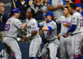 Oct 3, 2024; Milwaukee, Wisconsin, USA; New York Mets first baseman Pete Alonso (20) celebrates with teammates after hitting a three run home run against the Milwaukee Brewers in the ninth inning during game three of the Wildcard round for the 2024 MLB Playoffs at American Family Field. Mandatory Credit: Benny Sieu-Imagn Images