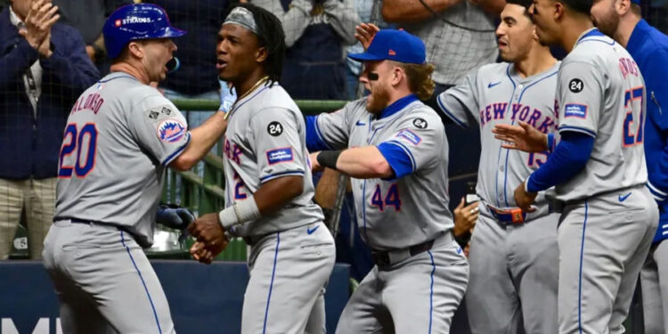 Oct 3, 2024; Milwaukee, Wisconsin, USA; New York Mets first baseman Pete Alonso (20) celebrates with teammates after hitting a three run home run against the Milwaukee Brewers in the ninth inning during game three of the Wildcard round for the 2024 MLB Playoffs at American Family Field. Mandatory Credit: Benny Sieu-Imagn Images