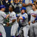 Oct 3, 2024; Milwaukee, Wisconsin, USA; New York Mets first baseman Pete Alonso (20) celebrates with teammates after hitting a three run home run against the Milwaukee Brewers in the ninth inning during game three of the Wildcard round for the 2024 MLB Playoffs at American Family Field. Mandatory Credit: Benny Sieu-Imagn Images