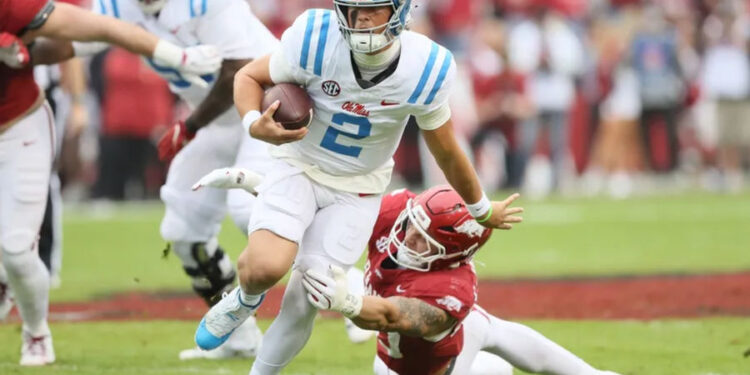 Nov 2, 2024; Fayetteville, Arkansas, USA; Ole Miss Rebels quarterback Jaxson Dart (2) rushes in the first quarter against the Arkansas Razorbacks at Donald W. Reynolds Razorback Stadium. Mandatory Credit: Nelson Chenault-Imagn Images