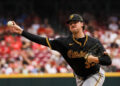 Sep 22, 2024; Cincinnati, Ohio, USA; Pittsburgh Pirates starting pitcher Paul Skenes (30) pitches against the Cincinnati Reds in the third inning at Great American Ball Park. Mandatory Credit: Katie Stratman-Imagn Images