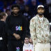 Nov 2, 2024; Philadelphia, Pennsylvania, USA; Injured Philadelphia 76ers Paul George (R) and Joel Embiid (L) look on during the first quarter against the Memphis Grizzlies at Wells Fargo Center. Mandatory Credit: Bill Streicher-Imagn Images