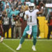 Dec 3, 2023; Landover, Maryland, USA; Miami Dolphins quarterback Tua Tagovailoa (1) drops back to pass against the Washington Commanders during the first half at FedExField. credits: Brad Mills-USA TODAY Sports