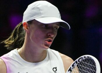 Iga Swiatek reacts during a match at the 2024 WTA Finals