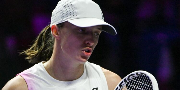 Iga Swiatek reacts during a match at the 2024 WTA Finals