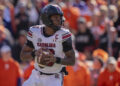 South Carolina quarterback LaNorris Sellers (16) drops back to pass in the first half of an NCAA college football game against Clemson, Saturday, Nov. 30, 2024, in Clemson, S.C. (AP Photo/Jacob Kupferman)