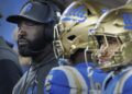 UCLA coach DeShaun Foster and his players watch the final seconds of the Bruins' loss to Oregon.