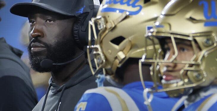 UCLA coach DeShaun Foster and his players watch the final seconds of the Bruins' loss to Oregon.