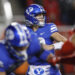 SALT LAKE CITY, UT - NOVEMBER 9:  Jake Retzlaff #12 of the Brigham Young Cougars throws a pass under pressure from the Utah Utes during the first half of their game at Rice-Eccles Stadium on November 9, 2024 in Salt Lake City, Utah.(Photo by Chris Gardner/Getty Images)