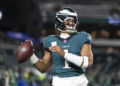 PHILADELPHIA, PENNSYLVANIA - NOVEMBER 14: Jalen Hurts #1 of the Philadelphia Eagles looks to pass prior to an NFL Football game against the Washington Commanders at Lincoln Financial Field on November 14, 2024 in Philadelphia, Pennsylvania. (Photo by Michael Owens/Getty Images)