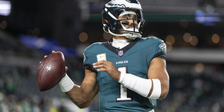 PHILADELPHIA, PENNSYLVANIA - NOVEMBER 14: Jalen Hurts #1 of the Philadelphia Eagles looks to pass prior to an NFL Football game against the Washington Commanders at Lincoln Financial Field on November 14, 2024 in Philadelphia, Pennsylvania. (Photo by Michael Owens/Getty Images)