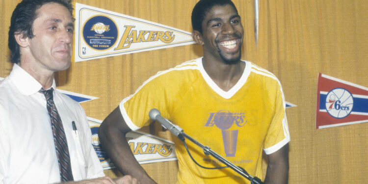 INGLEWOOD, CA - CIRCA 1982: Head Coach  Pat Riley and Magic Johnson #32 of the Los Angeles Lakers talks to the media after an NBA basketball game circa 1982 at The Forum in Inglewood, California. Riley coached the Lakers from 1981-1990. (Photo by Focus on Sport/Getty Images) *** Local Caption *** Pat Riley; Magic Johnson