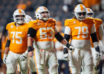 KNOXVILLE, TENNESSEE - NOVEMBER 09: Jackson Lampley #75 of the Tennessee Volunteers, Cooper Mays #63, and Shamurad Umarov #79 look on against the Mississippi State Bulldogs during their game at Neyland Stadium on November 09, 2024 in Knoxville, Tennessee. (Photo by Jacob Kupferman/Getty Images)