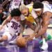 Lakers guard D'Angelo Russell battles 76ers Jared McCain and Guerschon Yabusele for a loose ball at Crypto.com Arena.