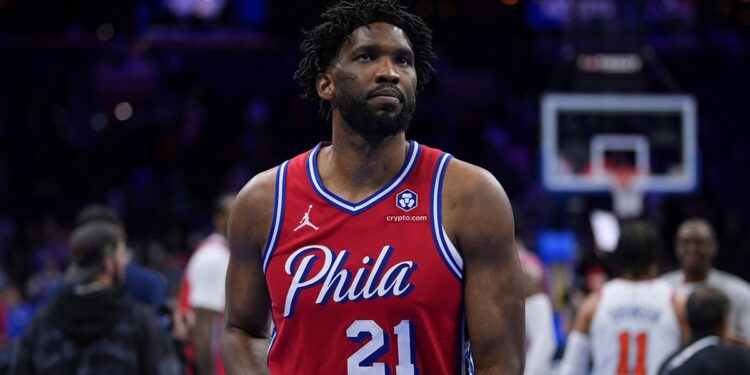 Joel Embiid walks off the court