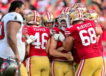 <span>Jake Moody celebrates with his San Francisco 49ers teammates after scoring the game-winning field goal against the Tampa Bay Buccaneers.</span><span>Photograph: Julio Aguilar/Getty Images</span>