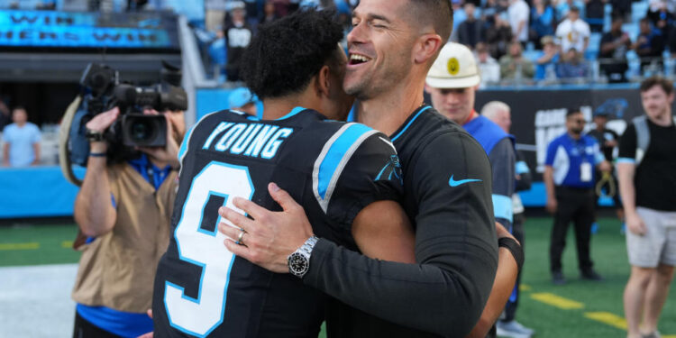 CHARLOTTE, NORTH CAROLINA - NOVEMBER 03: Head coach Dave Canales and Bryce Young #9 of the Carolina Panthers embrace after a win over the New Orleans Saints at Bank of America Stadium on November 03, 2024 in Charlotte, North Carolina. (Photo by Grant Halverson/Getty Images)