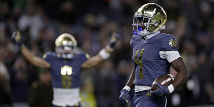 Notre Dame running back Jeremiyah Love scores a touchdown during the first half of an NCAA college football game against Army at Yankee Stadium on Saturday, Nov. 23, 2024, in New York. (AP Photo/Adam Hunger)