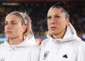 Alexia Putellas and Jennifer Hermoso of Spain line up for the national anthem