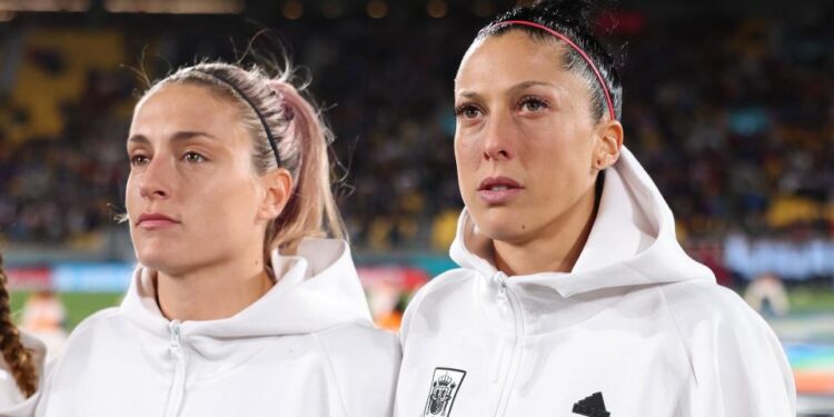 Alexia Putellas and Jennifer Hermoso of Spain line up for the national anthem