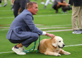 TUSCALOOSA, ALABAMA - SEPTEMBER 28: ESPN sportscaster Kirk Herbstreit and his dog Ben look on before the game between the Alabama Crimson Tide and the Georgia Bulldogs at Bryant-Denny Stadium on September 28, 2024 in Tuscaloosa, Alabama. (Photo by Kevin C. Cox/Getty Images)