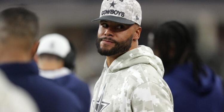 Dallas Cowboys quarterback Dak Prescott watches play against the Philadelphia Eagles in the second half of an NFL football game in Arlington, Texas, Sunday, Nov. 10, 2024. (AP Photo/Jeffrey McWhorter)