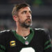 EAST RUTHERFORD, NEW JERSEY - OCTOBER 31: Aaron Rodgers #8 of the New York Jets stands on the sidelines during the national anthem prior to an NFL football game against the Houston Texans, at MetLife Stadium on October 31, 2024 in East Rutherford, New Jersey. (Photo by Kevin Sabitus/Getty Images)