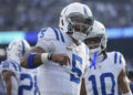 Indianapolis Colts quarterback Anthony Richardson (5) reacts after scoring a touchdown against the New York Jets during the second quarter of an NFL football game, Sunday, Nov. 17, 2024, in East Rutherford, N.J. (AP Photo/Seth Wenig)