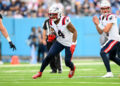 Nov 3, 2024; Nashville, Tennessee, USA;  New England Patriots running back Antonio Gibson (4) runs the ball against the Tennessee Titans during the second half at Nissan Stadium. Mandatory Credit: Steve Roberts-Imagn Images