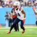 Nov 3, 2024; Nashville, Tennessee, USA;  New England Patriots running back Antonio Gibson (4) runs the ball against the Tennessee Titans during the second half at Nissan Stadium. Mandatory Credit: Steve Roberts-Imagn Images