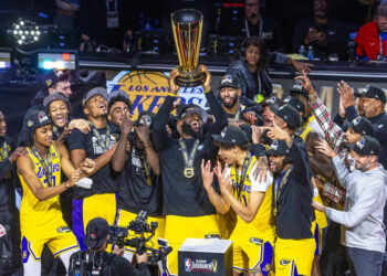 The Los Angeles Lakers' LeBron James holds up the winning trophy along with teammates after defeating the Indiana Pacers in their NBA in-season tournament championship game at T-Mobile Arena on Dec. 9, 2023, in Las Vegas. (L.E. Baskow/Las Vegas Review-Journal/Tribune News Service via Getty Images)