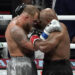 US YouTuber/boxer Jake Paul (L) and US retired pro-boxer Mike Tyson (R) hug at the end of their heavyweight boxing bout at The Pavilion at AT&T Stadium in Arlington, Texas, November 15, 2024. (Photo by TIMOTHY A. CLARY / AFP) (Photo by TIMOTHY A. CLARY/AFP via Getty Images)