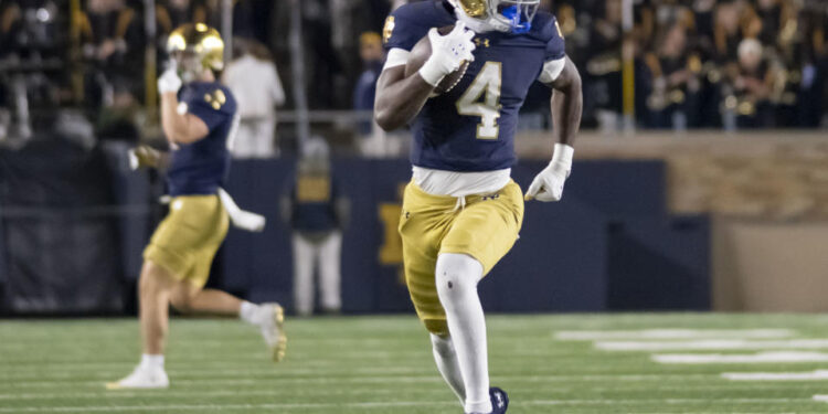 SOUTH BEND, IN - NOVEMBER 16: Notre Dame Fighting Irish running back Jeremiyah Love (4) runs the ball for a touchdown during the game between the Notre Dame Fighting Irish and the Virginia Cavaliers at Notre Dame Stadium in South Bend, IN on November 16, 2024. (Photo by Joseph Weiser/Icon Sportswire via Getty Images)