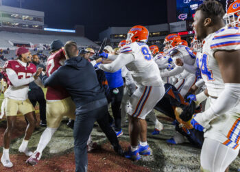 Florida State and Florida players scuffle at midfield after an NCAA college football game Saturday, Nov. 30, 2024, in Tallahassee, Fla. (AP Photo/Colin Hackley)