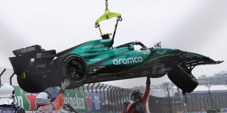 Autodromo Jose Carlos Pace, Sao Paulo, Brazil - November 3, 2024 Aston Martin's Fernando Alonso car is towed away by marshals after crashing out during qualifying