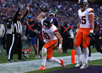 Bo Nix celebrates the first touchdown catch of his career. (Photo by Scott Taetsch/Getty Images)