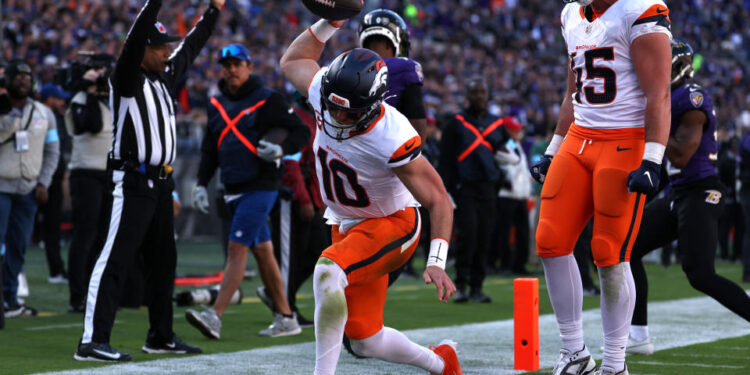 Bo Nix celebrates the first touchdown catch of his career. (Photo by Scott Taetsch/Getty Images)