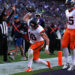 Bo Nix celebrates the first touchdown catch of his career. (Photo by Scott Taetsch/Getty Images)