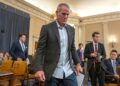 Brett Favre enters the chambers